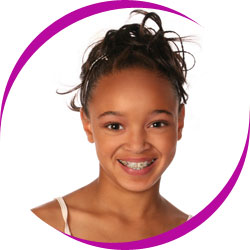 Young girl smiling with braces