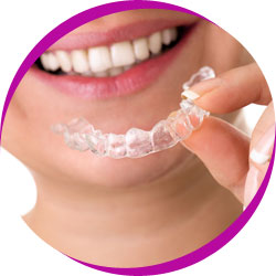 Lady using dental retainer