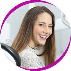 Teenage girl sitting in dentist chair